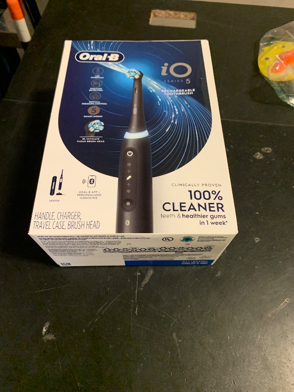 Photo 1 of Oral-B Rechargeable Electric Toothbrush, iO5 Customizable Clean, 5 Cleaning Modes, Visual Pressure Sensor to Protect Gums, Travel Case, Black