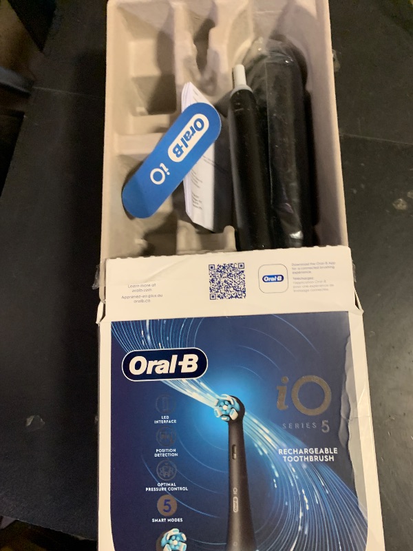 Photo 1 of Oral-B Rechargeable Electric Toothbrush, iO5 Customizable Clean, 5 Cleaning Modes, Visual Pressure Sensor to Protect Gums, Travel Case, Black