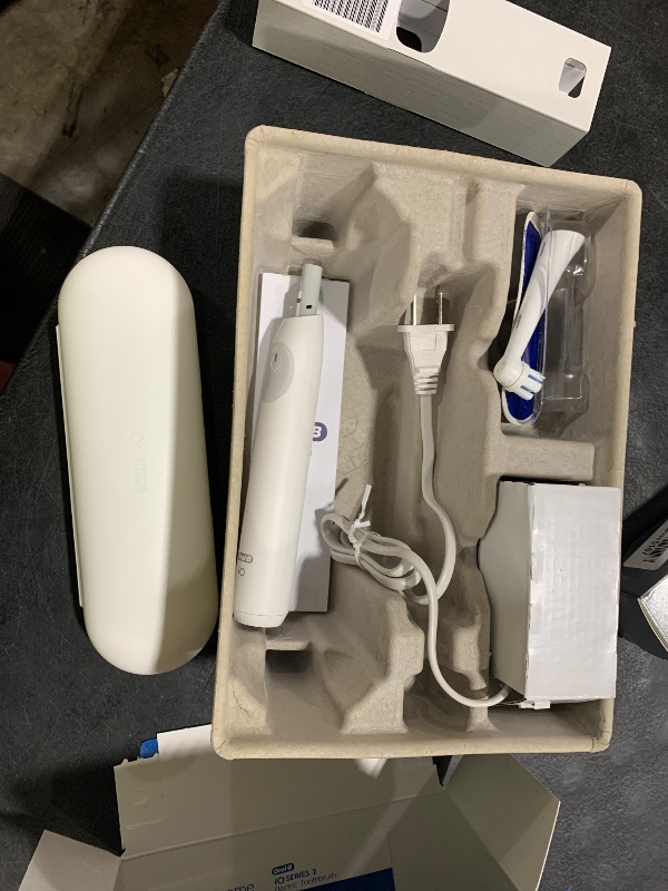 Photo 1 of Oral-B Rechargeable Electric Toothbrush, iO Limited Simple Clean, 3 Cleaning Modes, Automatic Pressure Sensor to Protect Gums, Travel Case, White