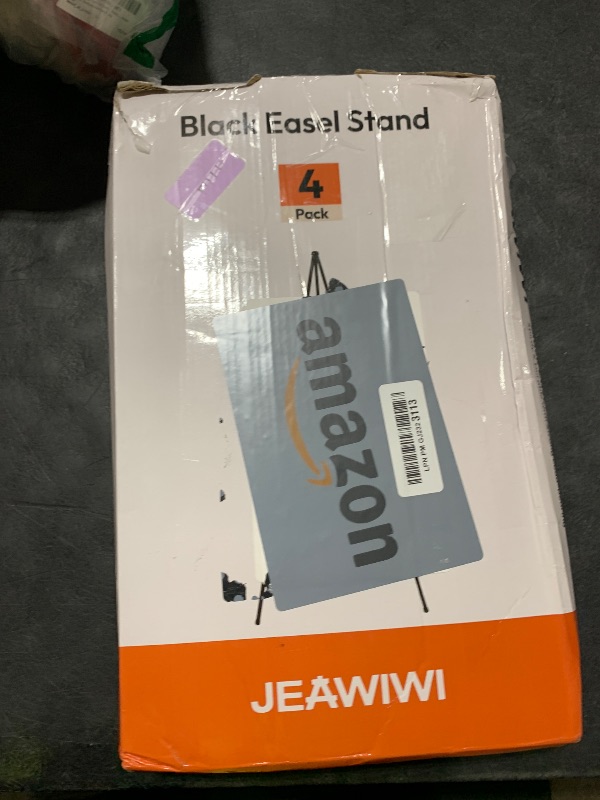 Photo 1 of JEAWIWI 4 Pcs Lifhtweight Easel Stand, 66 Inch, Black, with Portable Bags