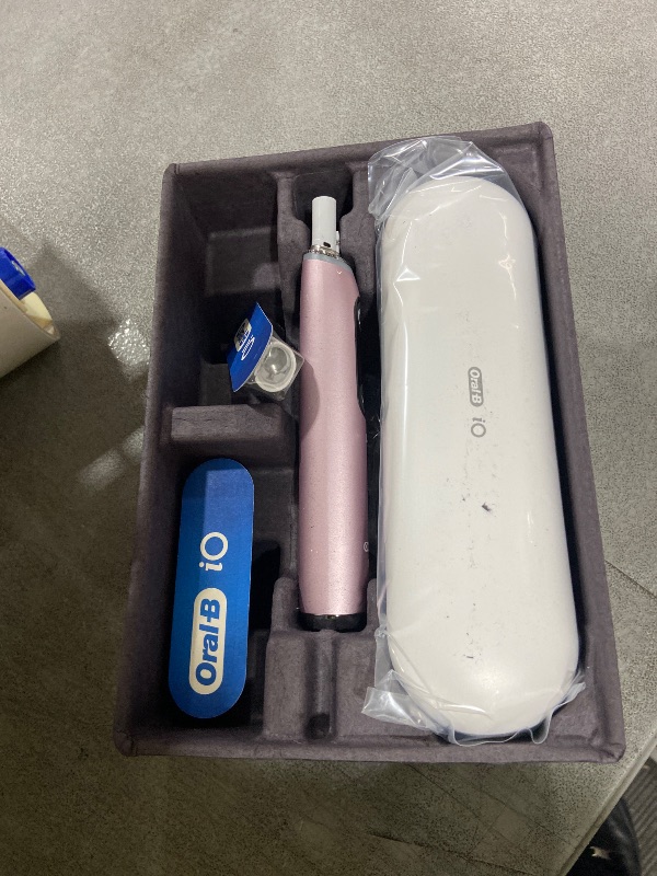 Photo 1 of Oral-B Rechargeable Electric Toothbrush, iO9 Limited Ultimate Clean, 7 Cleaning Modes, Interactive Display, iSense Charger, Charging Travel Case, Visible Pressure Sensor, 3 Brush Heads, Rose Quartz