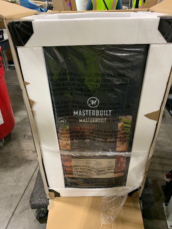Photo 1 of Masterbuilt® 40-inch Digital Electric Vertical BBQ Smoker with Side Wood Chip Loader, Chrome Smoking Racks and 970 Cooking Square Inches in Black, Model MB20072918
