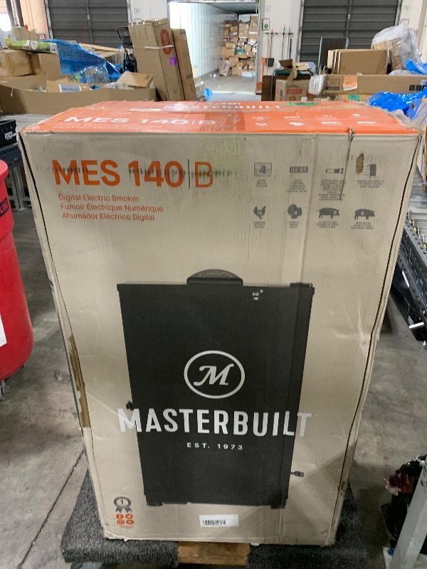 Photo 1 of Masterbuilt® 40-inch Digital Electric Vertical BBQ Smoker with Side Wood Chip Loader, Chrome Smoking Racks and 970 Cooking Square Inches in Black, Model MB20072918