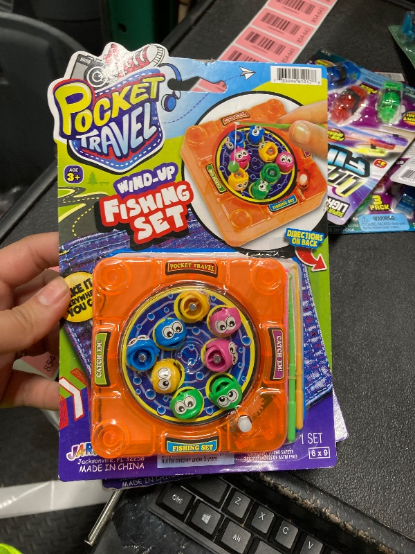 Photo 1 of [NEW] Pocket Travel Wind Up Fishing Game