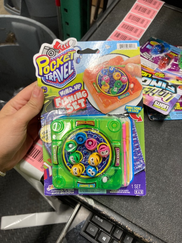 Photo 1 of [NEW] Pocket Travel Wind Up Fishing Game