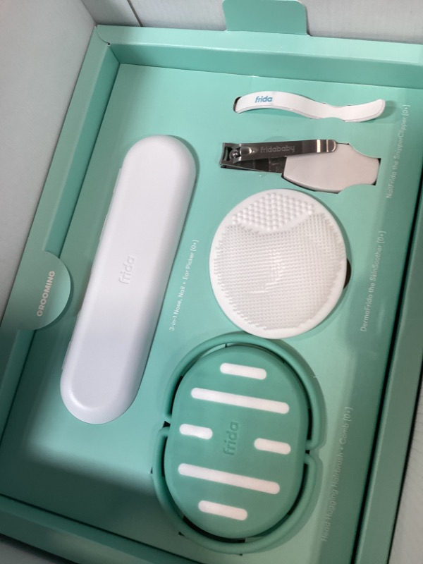 Photo 1 of Frida Baby Ultimate Baby Kit, 10 piece New Born Essentials Gift Set Includes Wellness Sick Day, Gas Relief, Grooming Tools & Teething Toys