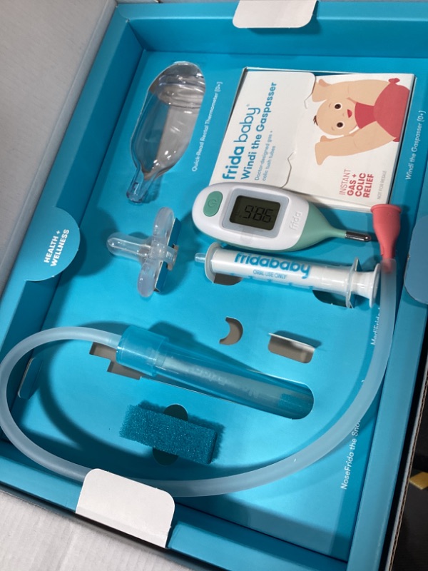 Photo 1 of Frida Baby Ultimate Baby Kit, 10 piece New Born Essentials Gift Set Includes Wellness Sick Day, Gas Relief, Grooming Tools & Teething Toys