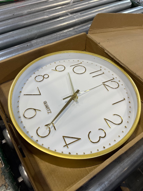 Photo 1 of bakbrand Wall Clock 10 Inch Non-Ticking Silent Modern Simple Style Round Decor Clock Gold Stereoscopic Dial Quartz Wall Clocks for Home/Office/School/Living Room/Bedroom/Kitchen