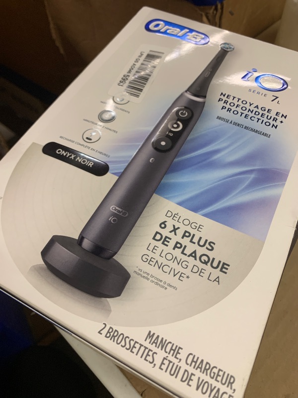 Photo 1 of Oral-B iO Deep Clean + Protect Rechargeable Electric Toothbrush, Black, iO Series 7, 2 Replacement Brush Heads, Charging Travel Case (package may vary)