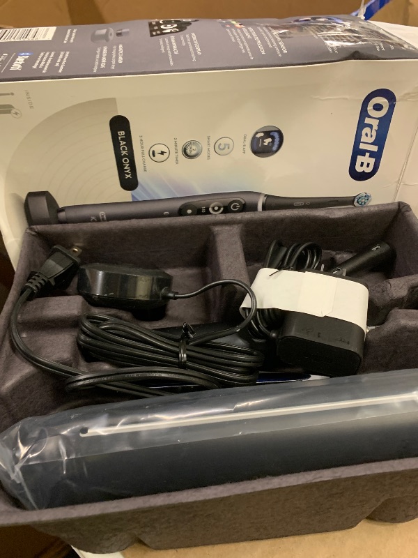 Photo 1 of Oral-B iO Deep Clean + Protect Rechargeable Electric Toothbrush, Black, iO Series 7, 2 Replacement Brush Heads, Charging Travel Case (package may vary)
