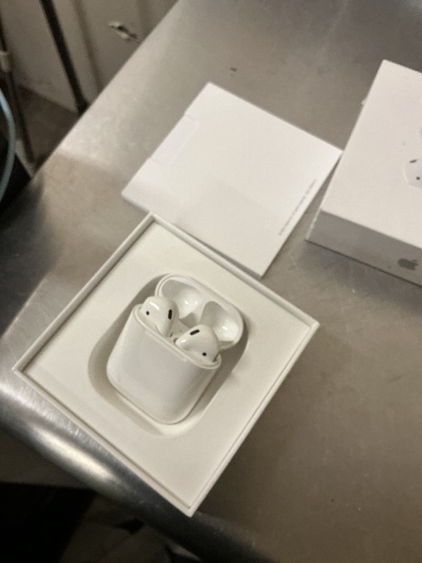 Photo 1 of Apple AirPods Wireless Earbuds with Lightning Charging Case