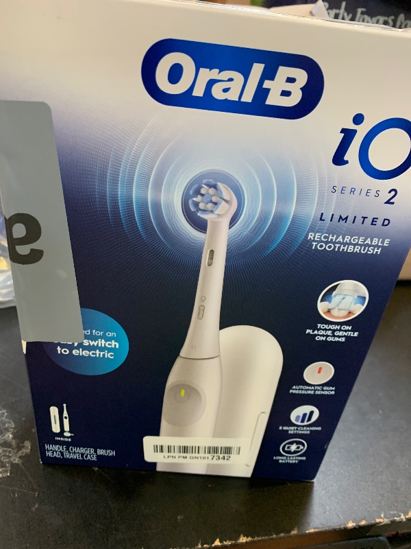 Photo 1 of Oral-B Rechargeable Electric Toothbrush, iO Limited Simple Clean, 3 Cleaning Modes, Automatic Pressure Sensor to Protect Gums, Travel Case, White