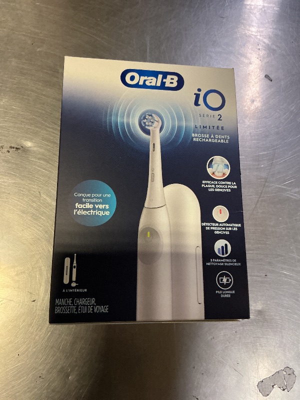 Photo 1 of Oral-B Rechargeable Electric Toothbrush, iO Limited Simple Clean, 3 Cleaning Modes, Automatic Pressure Sensor to Protect Gums, Travel Case, White