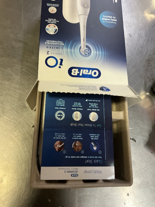 Photo 1 of Oral-B Rechargeable Electric Toothbrush, iO Limited Simple Clean, 3 Cleaning Modes, Automatic Pressure Sensor to Protect Gums, Travel Case, White
