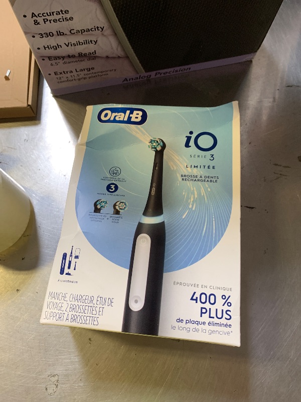 Photo 1 of Oral-B iO Series 3 Limited Deep Clean Rechargeable Electric Toothbrush for Adults, Black, 3 Modes, Smart Pressure Sensor, Plaque Removal and Gum Care, 2 Replacement Brush Heads, Travel Case