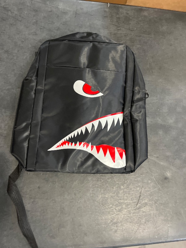 Photo 1 of Black backpack with shark design
