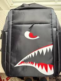 Photo 1 of Black backpack with shark design