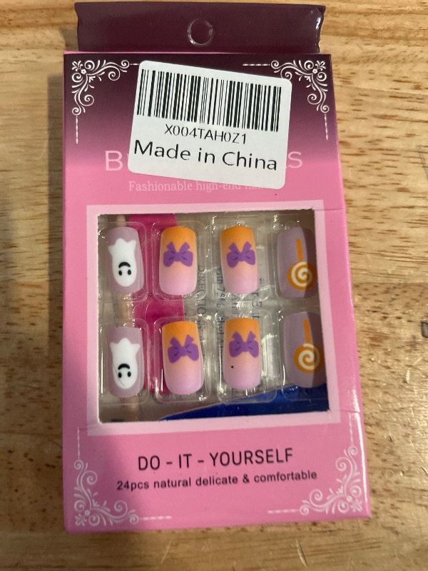 Photo 1 of 24Pcs Cute Halloween Press on Nails Short Square Fake Nails Fall Halloween False Nails with Pumpkin Ghost Bow Candy Design Purple Orange Nails Press ons Holiday Full Cover Glue on Nail for Women
