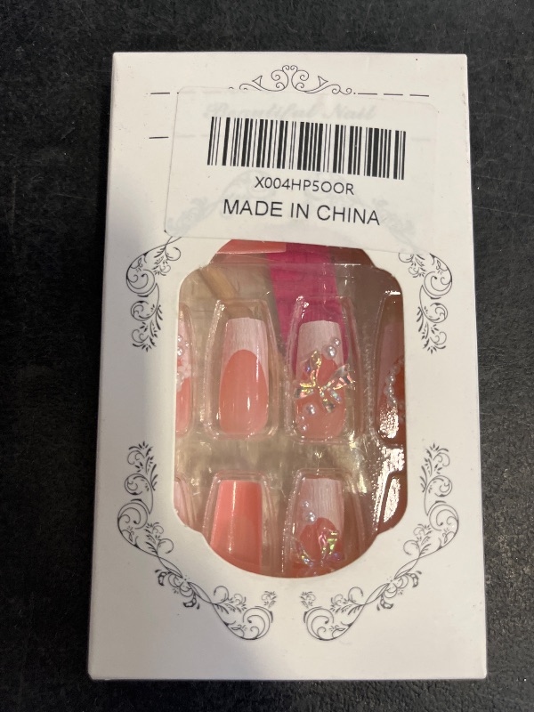 Photo 1 of 24Pcs French Tip Press on Nails Medium Almond Fake Nails with Pink Charms Bow Designs Nude Glossy Full Cover Artificial Glue on Nails Cute False Nails Stick on Nails for Women Girls DIY Manicure Kit