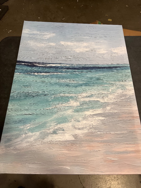 Photo 1 of Ocean waves rolling onto a sandy beach under an overcast sky painting Canvas