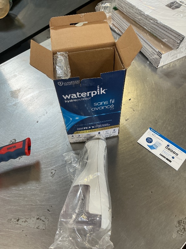 Photo 1 of Waterpik Cordless Advanced 2.0 Water Flosser For Teeth, Gums, Braces, Dental Care With Travel Bag and 4 Tips, ADA Accepted, Rechargeable, Portable, and Waterproof, White WP-580, Packaging May Vary