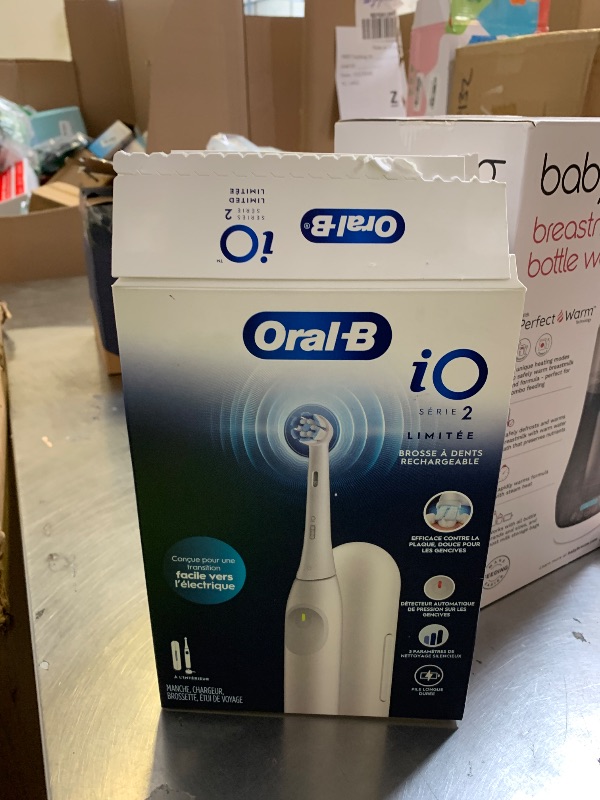 Photo 1 of Oral-B Rechargeable Electric Toothbrush, iO Limited Simple Clean, 3 Cleaning Modes, Automatic Pressure Sensor to Protect Gums, Travel Case, White