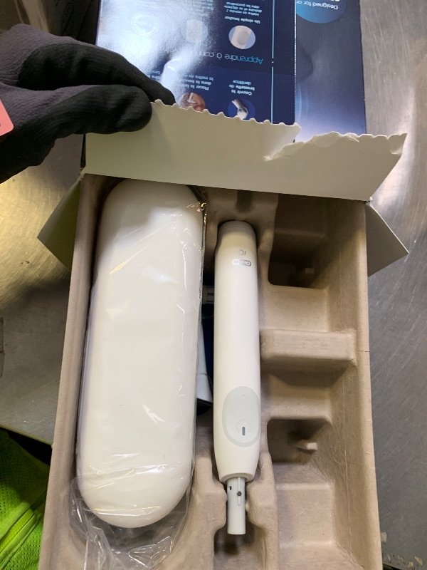 Photo 1 of Oral-B Rechargeable Electric Toothbrush, iO Limited Simple Clean, 3 Cleaning Modes, Automatic Pressure Sensor to Protect Gums, Travel Case, White