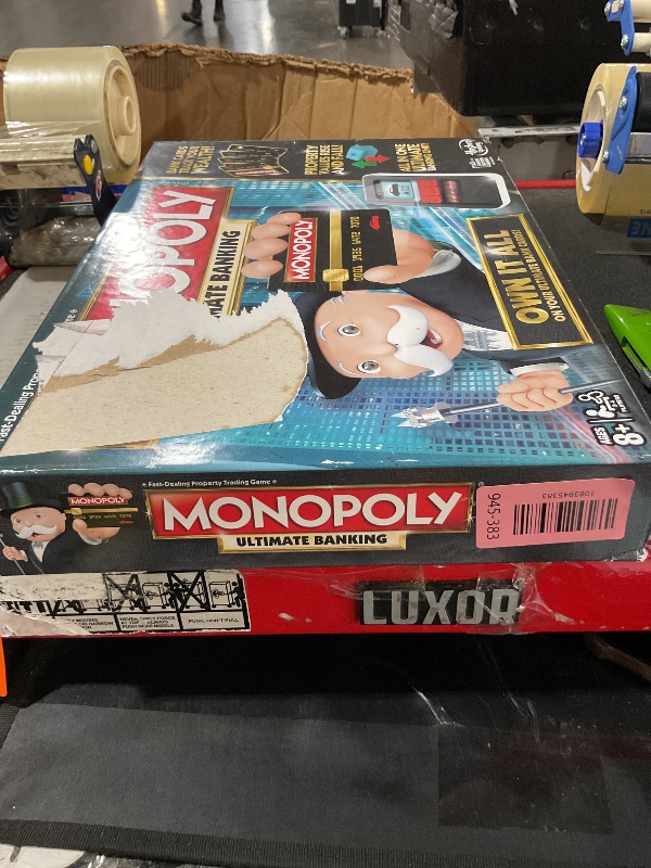 View 2 of ***MINOR DAMAGE***UNKNOWN IF MISSING PARTS***
Monopoly Ultimate Banking Edition Board Game