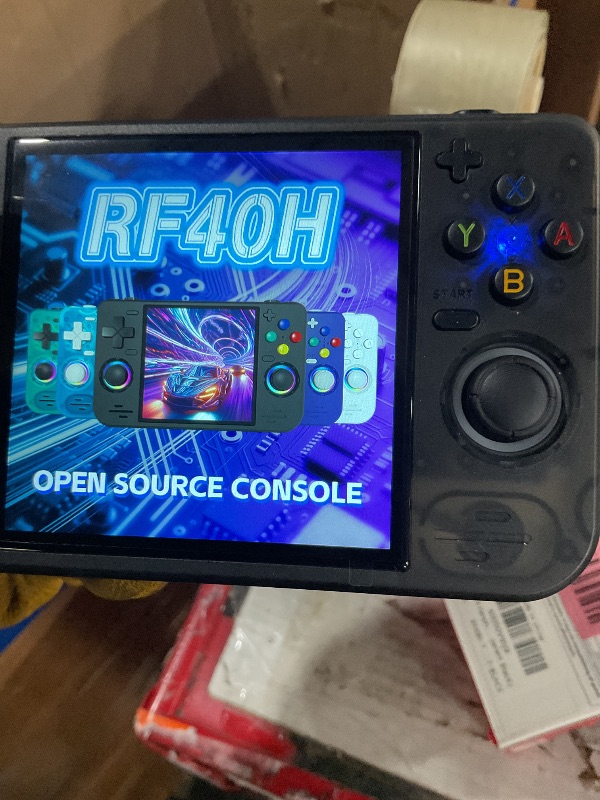 View 3 of RF40H Handheld Game Console, 4.0" Retro Gaming Console Preloaded 20,000+ Classic Games, Open Source Linux System, Support WiFi Online Play, Portable Pocket Hand Held Video Game (Transparent Black)