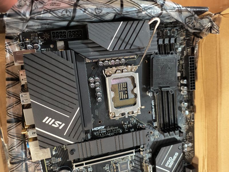 Photo 1 of ***DAMAGED - SEE NOTES/PICTURES***MSI PRO Z790-P WiFi ProSeries Motherboard (Supports 12th/13th/14th Gen Intel Processors, LGA 1700, DDR5, PCIe 5.0, M.2, 2.5Gbps LAN, USB 3.2 Gen2, HDMI/DP, Wi-Fi 6E, Bluetooth 5.3, ATX) (Renewed)