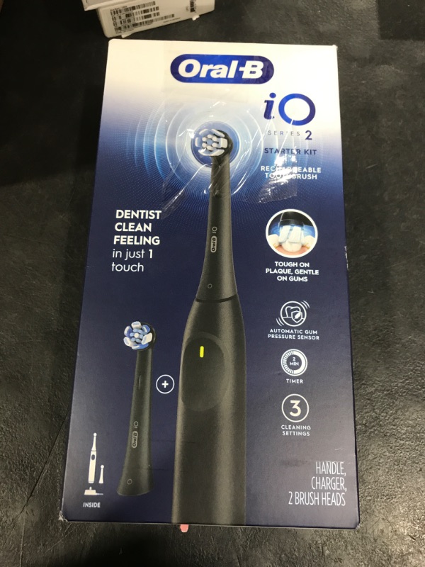 Photo 1 of Oral-B Rechargeable Electric Toothbrush, iO2 Starter Kit, 3 Cleaning Modes, Automatic Pressure Sensor to Protect Gums, 2 Brush Heads, Night Black