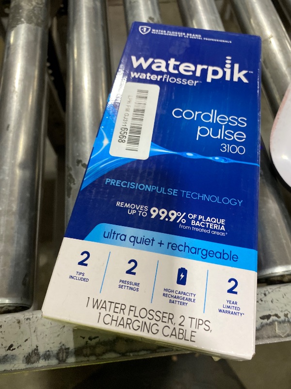 Photo 1 of Waterpik Cordless Pulse 3100 Portable Water Flosser, Rechargeable, White