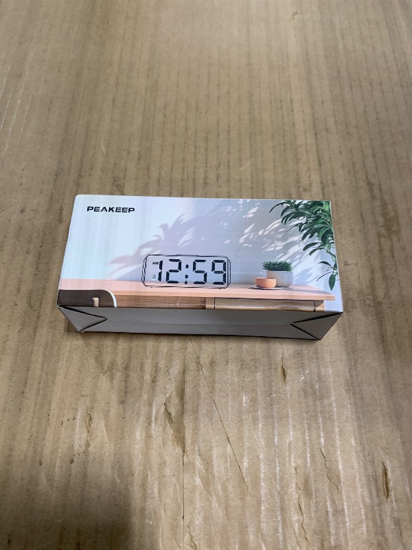 Photo 1 of *See Clerk Notes* Peakeep Small Battery Powered Digital Alarm Clock