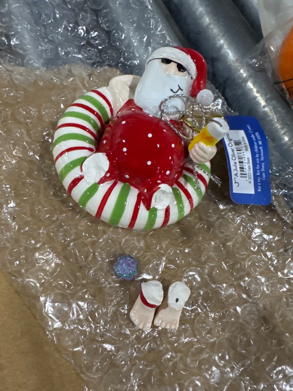 Photo 1 of ***FOR PARTS***Cape Shore Santa Relaxing on an Inner Tube Float with a Tropical Drink Ornament