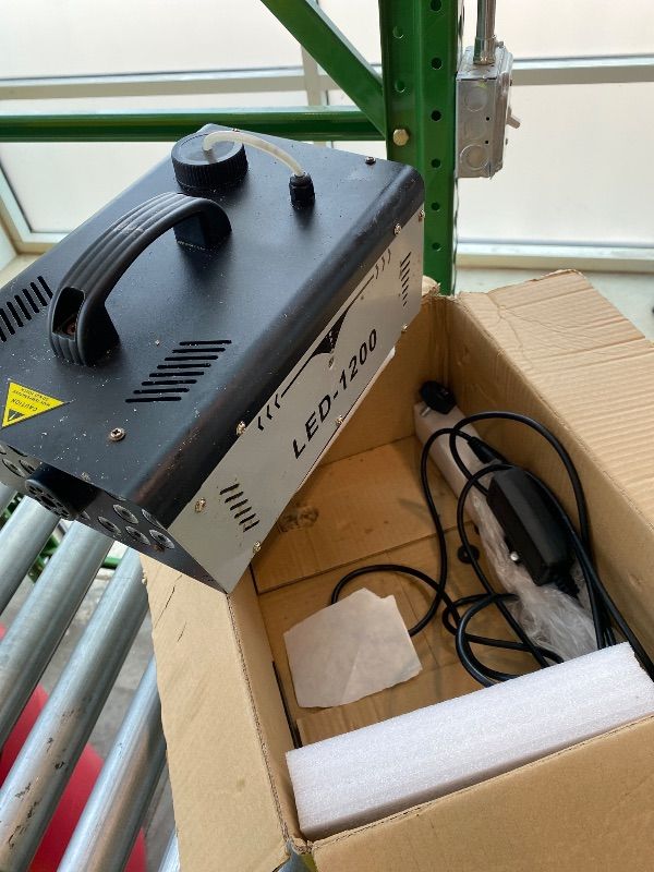 Photo 1 of *See Clerk Notes* 1200W Fog Machine Outdoor Indoor, 18 Lights Halloween Smoke Machine Fog with 6000CFM, 13 Colors & Remote Controls for Party Stage Effect