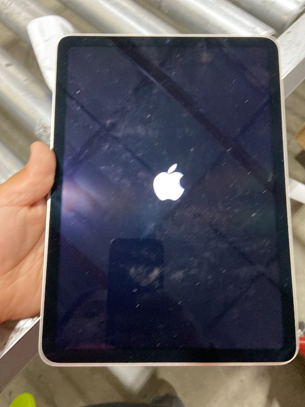 Photo 1 of Apple iPad Air (5th Generation): with M1 chip, 10.9-inch Liquid Retina Display, 64GB, Wi-Fi 6, 12MP front/12MP Back Camera, Touch ID, All-Day Battery Life – Starlight
