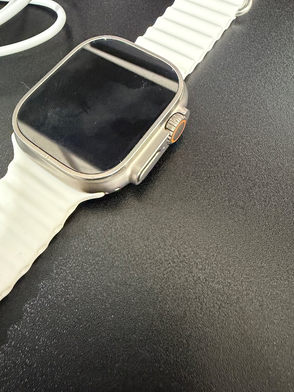 Photo 1 of Apple Watch Ultra 2 [GPS + Cellular 49mm] Smartwatch with Rugged Titanium Case & White Ocean Band. Fitness Tracker, Precision GPS, Action Button, Extra-Long Battery Life, Bright Retina Display