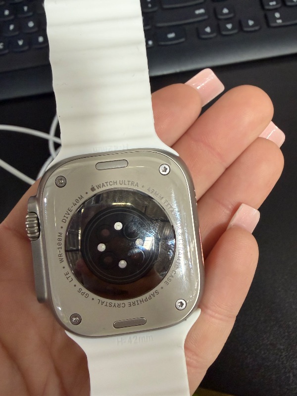 Photo 1 of Apple Watch Ultra 2 [GPS + Cellular 49mm] Smartwatch with Rugged Titanium Case & White Ocean Band. Fitness Tracker, Precision GPS, Action Button, Extra-Long Battery Life, Bright Retina Display