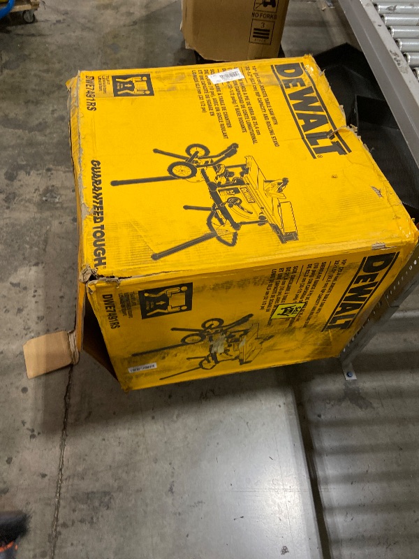 Photo 1 of DEWALT 10" Table Saw with Rolling Stand, 15 Amp, 32-1/2" Rip Capacity