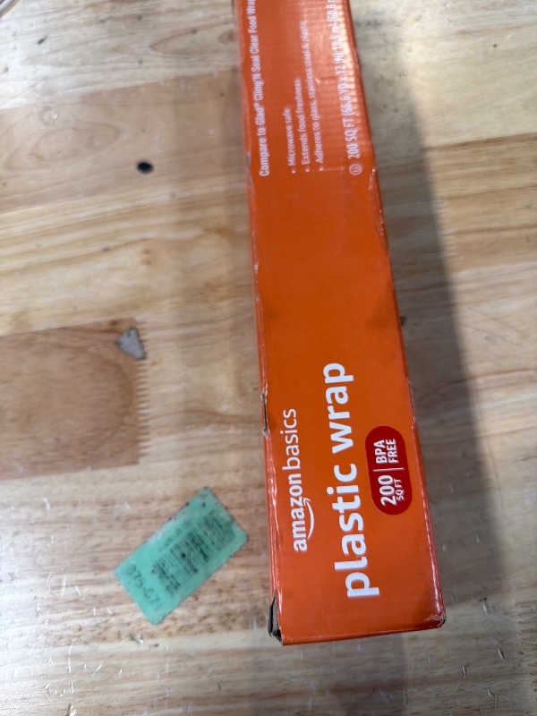 Photo 1 of ***PIECES RIPPED OFF ALL OVER ROLL *** Amazon Basics Plastic Food Wrap, BPA Free, Microwavable, 200 Sq Ft, Pack of 1