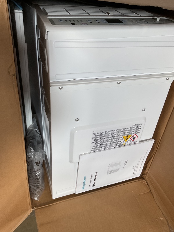 Photo 1 of ** front face plate is cracked/loose** Keystone 10,000 BTU Slider Window Air Conditioner and Dehumidifier, 115V Air Conditioner Window Unit for Bedroom, Living Room, and Small-Medium Sized Rooms up to 450 Sq.Ft, 4-Way Air Direction Control