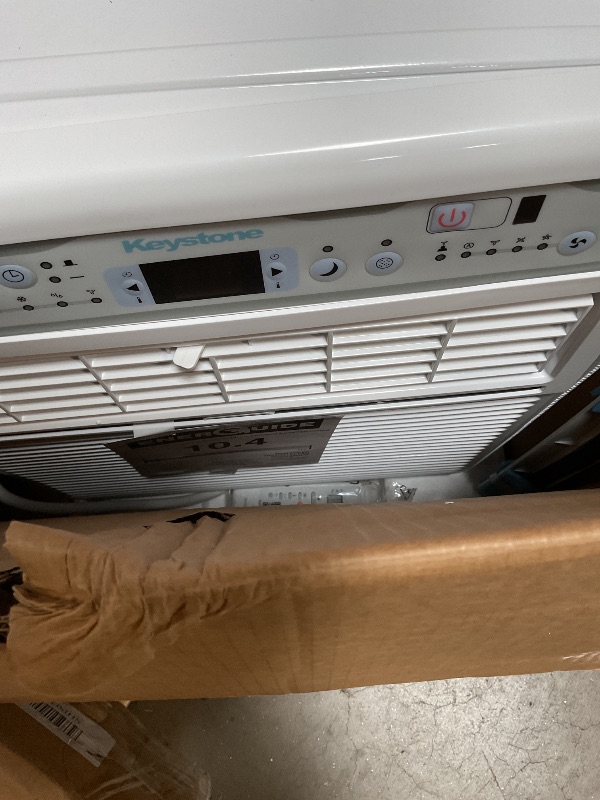 Photo 1 of ** front face plate is cracked/loose** Keystone 10,000 BTU Slider Window Air Conditioner and Dehumidifier, 115V Air Conditioner Window Unit for Bedroom, Living Room, and Small-Medium Sized Rooms up to 450 Sq.Ft, 4-Way Air Direction Control