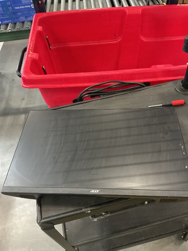 Photo 1 of rolling desk with mounted monitor and acer monitor