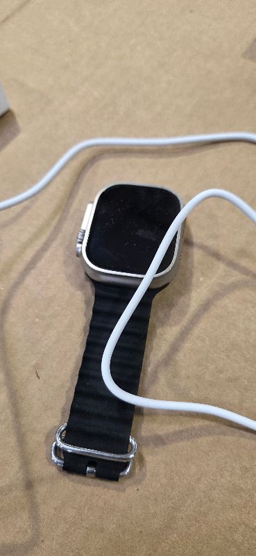 Photo 1 of Apple Watch Ultra [GPS + Cellular 49mm] Titanium Case with Midnight Ocean Band, One Size (Renewed)