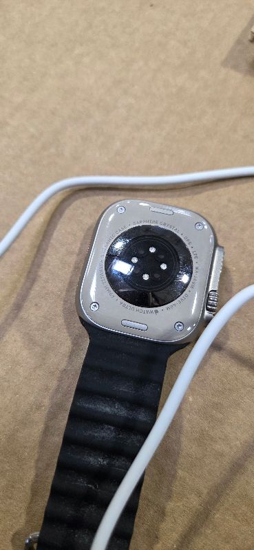 Photo 1 of Apple Watch Ultra [GPS + Cellular 49mm] Titanium Case with Midnight Ocean Band, One Size (Renewed)