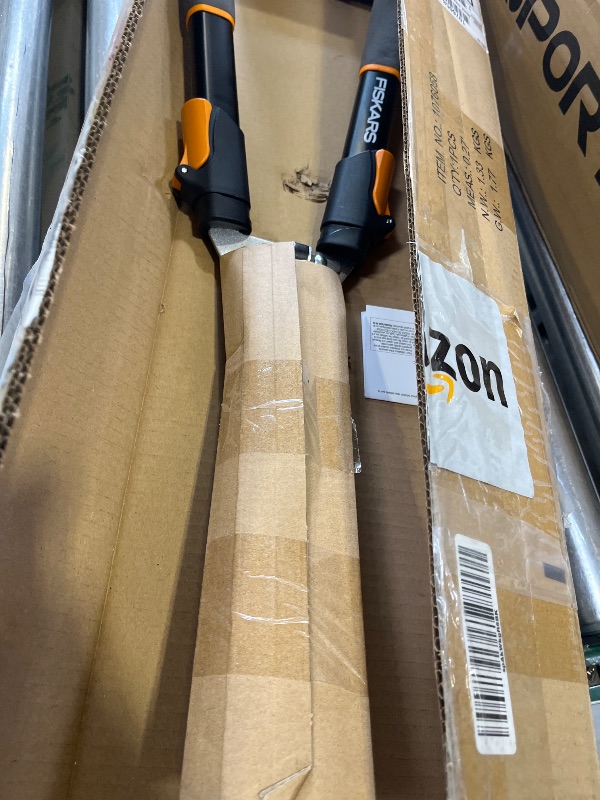 Photo 1 of Fiskars Power-Lever Extendable Hedge Shears, Self-Sharpening Serrated Steel Blades for Clean Cuts, Handles Adjust 25"-33" for High Reach, Multiplies Leverage for 2x Power, 10" Blades, Orange/Black