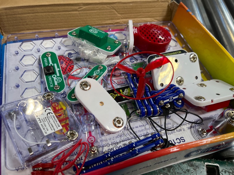 Photo 1 of Snap Circuits Jr. SC-100 Electronics Exploration Kit, Over 100 Projects, Full Color Project Manual, 28 Parts, STEM Educational Toy for Kids 8 +