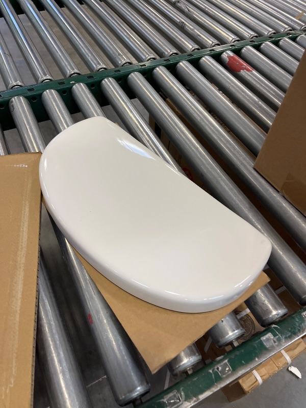 Photo 1 of Gerber Maxwell Crest Elongated Two-Piece Toilet, Soft-Close Seat, White-----toilet is broken ----- selling only the back part the seat and some hardware view pictures
