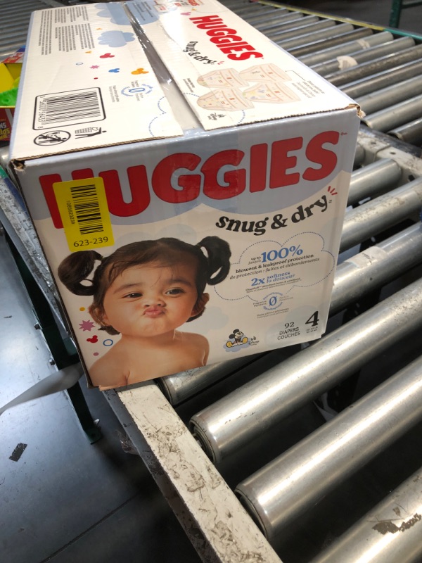 View 2 of ***FACTORY SEALED ***
Huggies Size 4 Diapers, Snug & Dry Baby Diapers, Size 4 (22-37 lbs), 92 Count, Packaging May Vary
