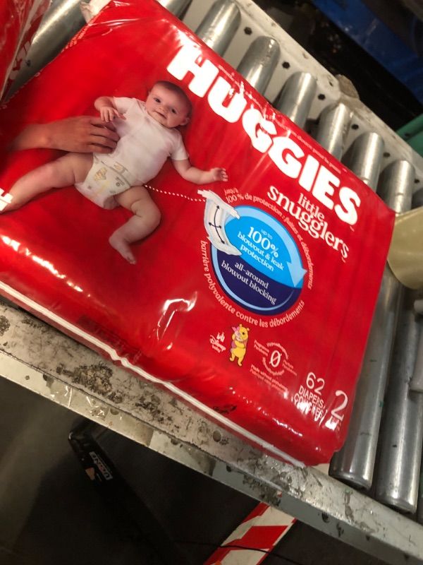 Photo 1 of ***STOCK PHOTO FOR REFERENCE ONLY***\
Huggies Size 2 Diapers, Little Snugglers Baby Diapers, Size 2 (16-28 lbs), 62 Count, Packaging May Vary
